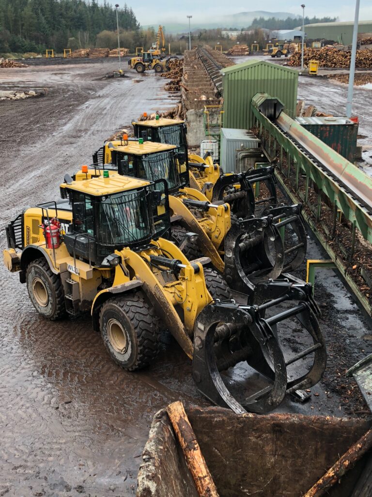 Timber handling grapples on a client's loading machine.
