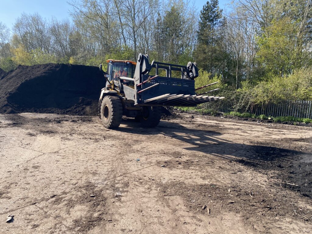 Ulrich compost fork in use by a customer of Ulrich Attachments.