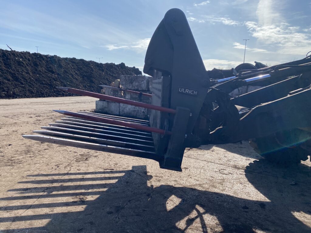 Side view of Ulrich compost fork pictured with Ulrich logo displayed.